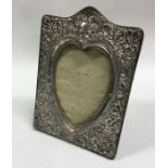 A silver mounted heart shaped picture frame. Birmi