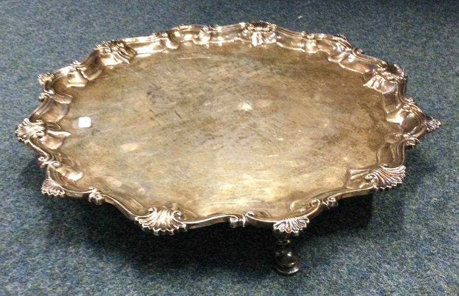 A large Georgian silver salver with shell border. - Image 2 of 3