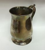 A heavy George III silver mug on spreading foot. L