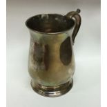 A heavy George III silver mug on spreading foot. L