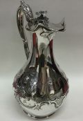 A fine quality Victorian chased silver jug embosse