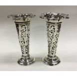 A pair of Edwardian silver tapering spill vases wi