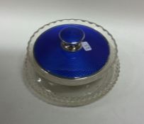 An attractive blue enamel and silver mounted glass