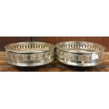 A pair of silver plated wine coasters. Est. £20 -