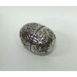 An 18th Century chased silver nutmeg grater of goo