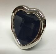 A large plain silver heart shaped picture frame. L