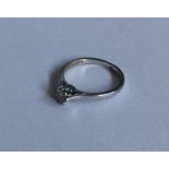 A diamond single stone ring in platinum claw mount