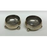A pair of Victorian silver cylindrical salts on ba