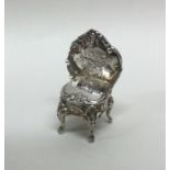 A small novelty miniature silver chair of Rococo d