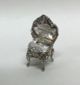 A small novelty miniature silver chair of Rococo d