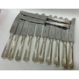 A good set of twelve silver handled table knives o