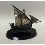 A Continental silver model of a boat on ebony base