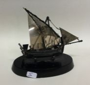 A Continental silver model of a boat on ebony base