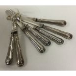 A matched set of silver handled dessert eaters. Ap