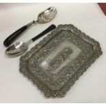 A Continental silver embossed dish together with m
