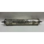 A large cast silver Judaica scroll holder attracti