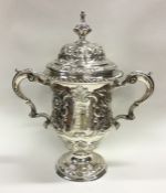 A large Georgian chased silver cup and cover decor
