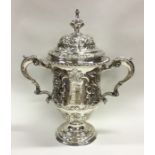 A large Georgian chased silver cup and cover decor