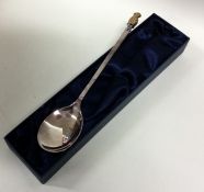 A tapering silver christening spoon mounted with g