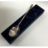 A tapering silver christening spoon mounted with g