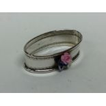 A silver and porcelain mounted napkin ring decorat