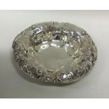 A Continental silver bonbon dish with scroll decor