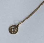 A 9 carat Masonic pendant on fine link chain. Appr