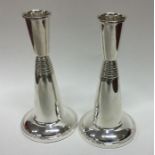 A stylish pair of tapering modernistic silver cand