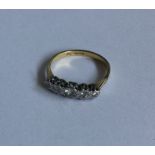 A good diamond five stone half hoop ring in two co