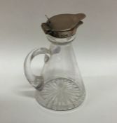 A tapering silver mounted and glass whisky tot wit