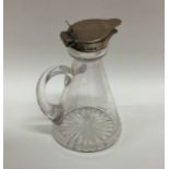 A tapering silver mounted and glass whisky tot wit