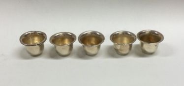 A set of six miniature silver goblets with gilt in