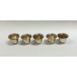 A set of six miniature silver goblets with gilt in