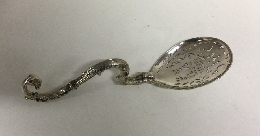 A heavy cast silver sifter spoon with scroll handl - Image 2 of 2
