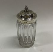 A Victorian silver mounted glass sugar caster. She