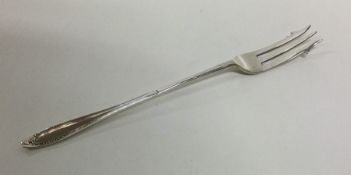 A large silver pickle fork of typical form. Sheffi