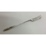 A large silver pickle fork of typical form. Sheffi