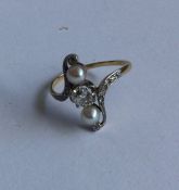 A stylish Art Nouveau pearl and diamond ring in go