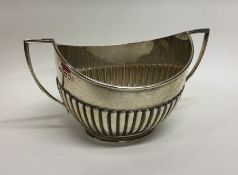 An Edwardian silver half fluted sugar bowl. London