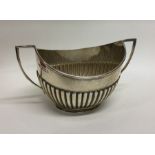 An Edwardian silver half fluted sugar bowl. London