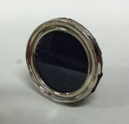 A small circular silver picture frame. Approx. 7 c