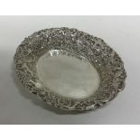 A heavy Edwardian silver oval bonbon dish with sha