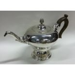 A good large George III silver teapot attractively