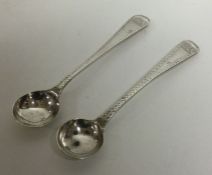 A pair of George II bright cut and crested silver