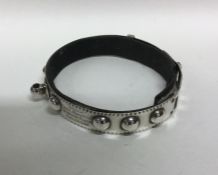 A rare silver and leather dog collar with ball mou