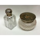 An Edwardian silver hinged top scent bottle togeth