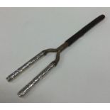 A pair of silver mounted curling tongs decorated w