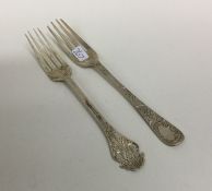 Two silver christening forks engraved with flowers