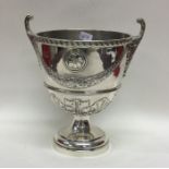 An unusual urn shaped silver vase decorated with s
