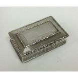 A heavy rectangular silver snuff box with hinged t